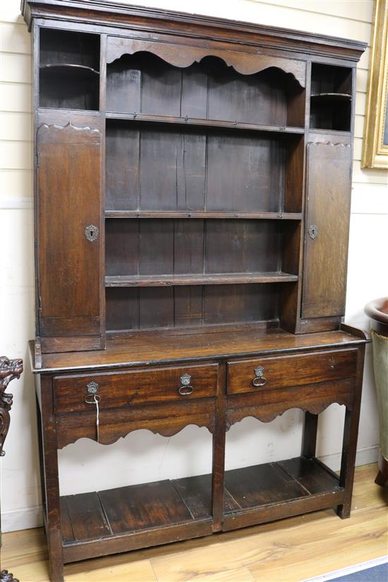 A mid 18th century oak dresser, with later upper section W.131cm